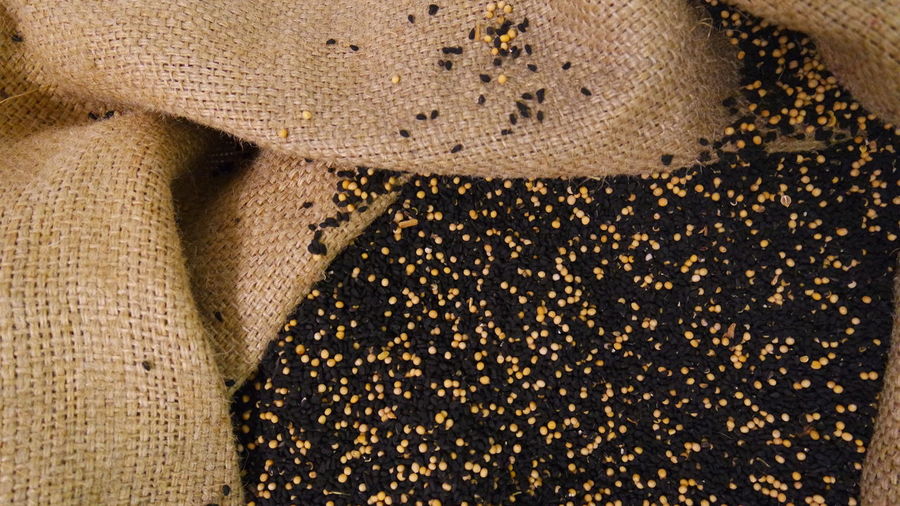 Directly above shot of sesame seeds in jute sack