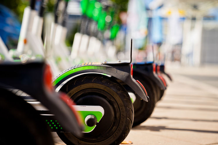 Close-up of electric push scooters