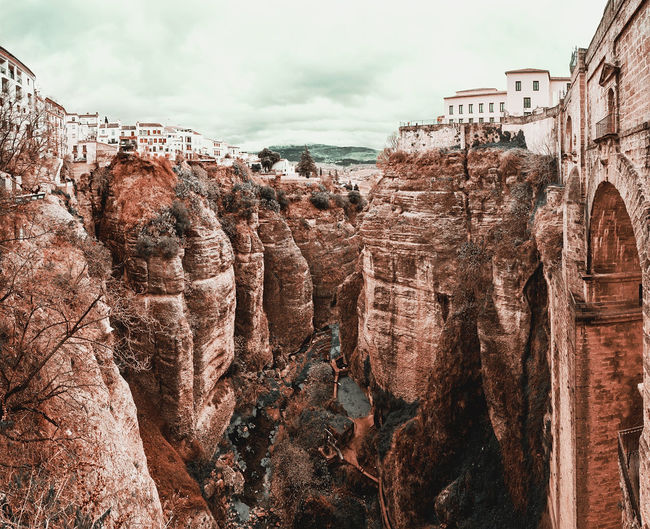 High angle view of buildings on rock formation against sky