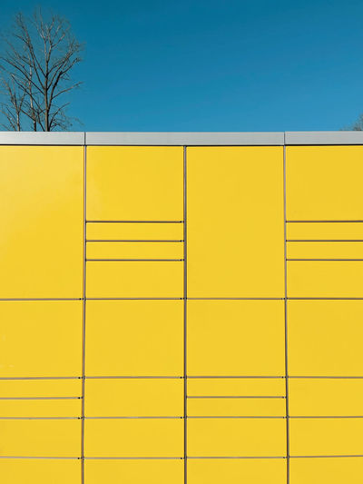 Low angle view of yellow wall