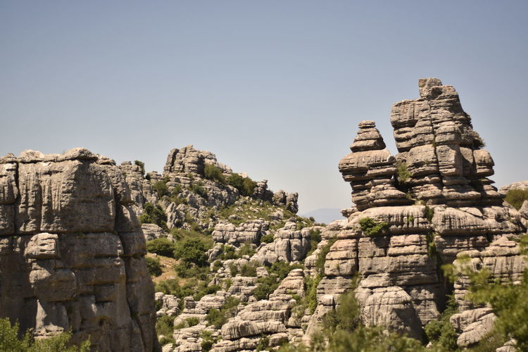 Low angle view of ancient mountain against clear sky