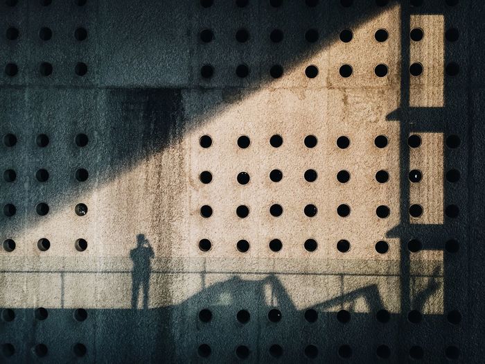 High angle view of shadow on wall