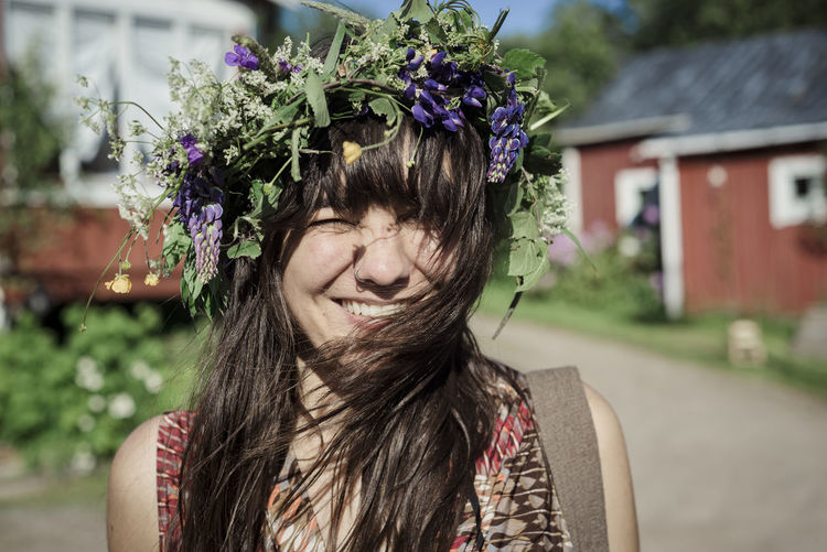 Happy woman wearing flower wreath