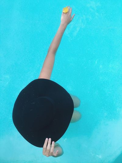 High angle view of eccentric woman in swimming pool