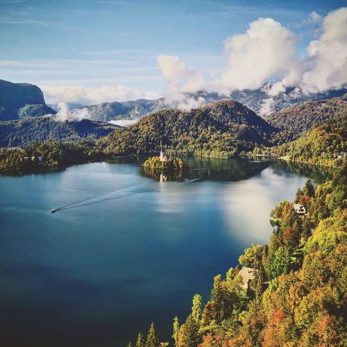 Scenic view of lake and trees against sky