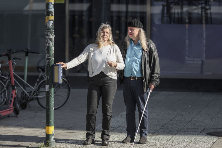 Senior couple standing at crosswalk