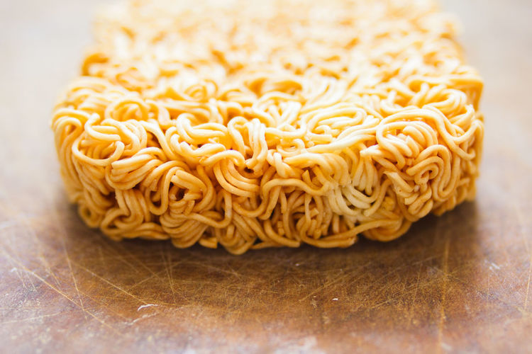 Close-up of raw noodles on table