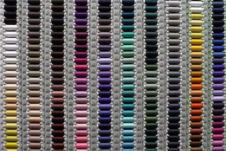 Full frame shot of multi colored spools