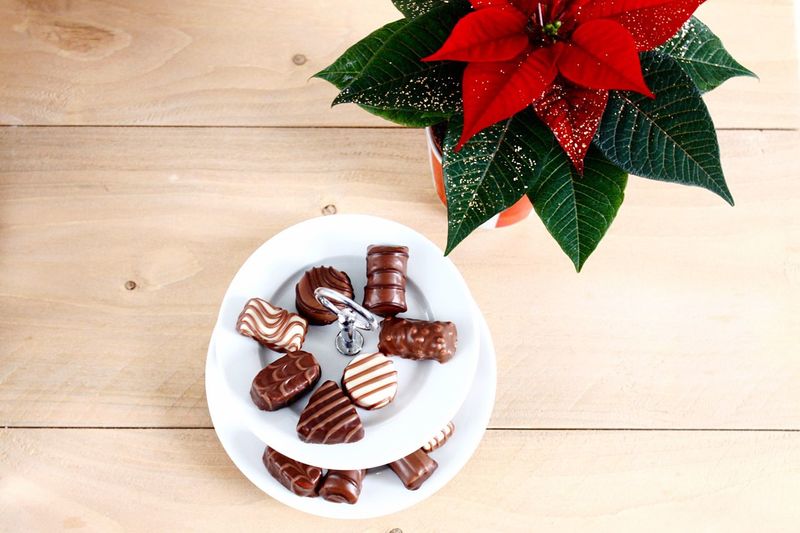 Close-up of chocolate and christmas decoration on table