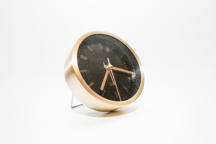 High angle view of clock on white background