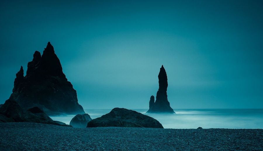 Scenic view of sea against blue sky