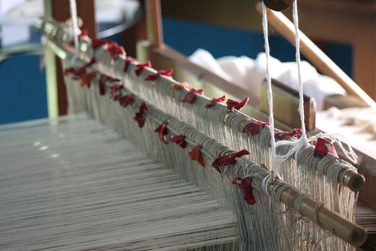 Threads on loom at factory