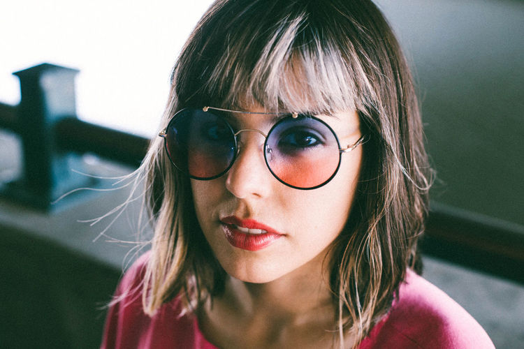 Beautiful Woman Close-up Day Eyeglasses Front View Glasses Hair Headshot Indoors Looking At Camera Makeup Natural Light One Person Orange Color People Pink Color Portrait Real People Young Adult Young Women