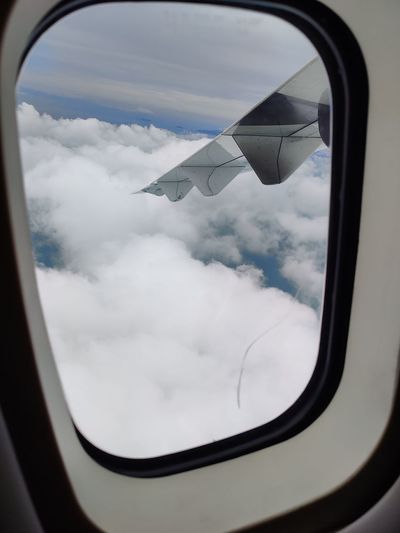 View of sky on side-view mirror