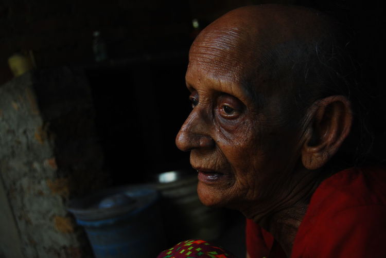 Portrait of an old woman looking away