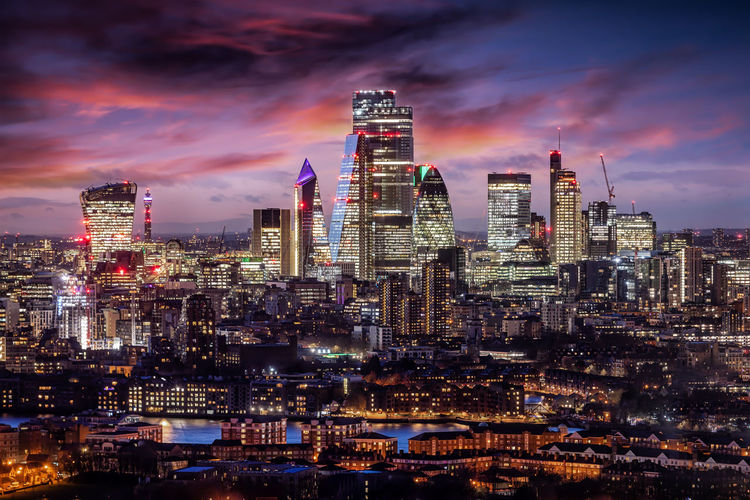 Illuminated buildings against sky