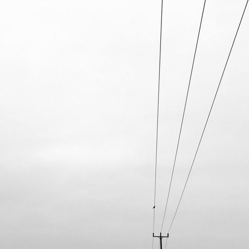 Low angle view of power lines