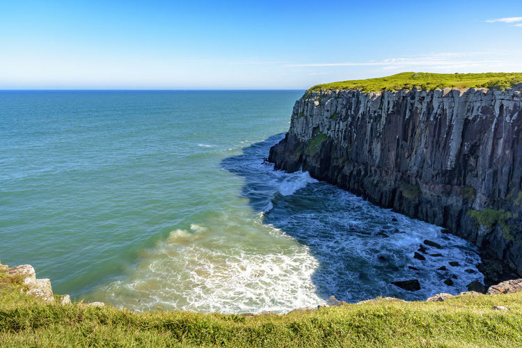 Guarita stone in the torres city in rio grande do sul with its cliffs ending in the sea with waves