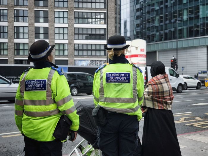 Rear view of policewomen on london street