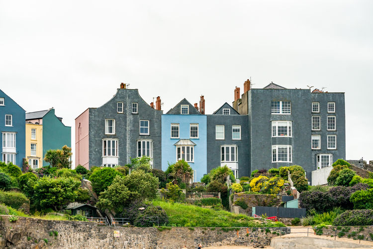 Clifftop houses by the beach in tenby, a seaside town in pembrokeshire, wales