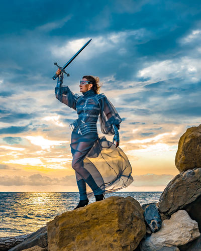 Full length of man standing on rock