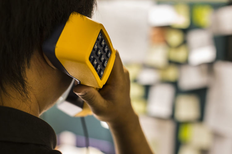 Cropped image of man talking on telephone