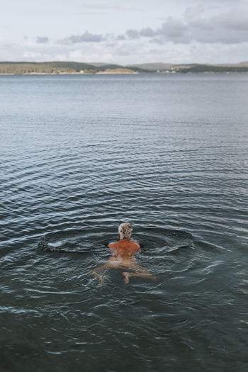 Woman swimming in sea