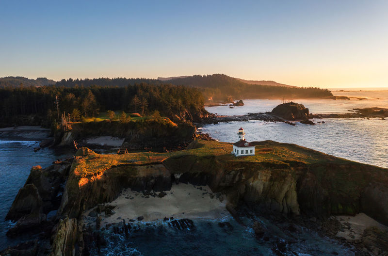 Cape arago lighthouse oregon coast. also seen in photo is shore acres and sunset bay state park. 