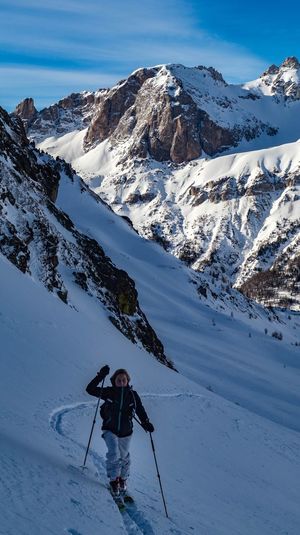 Girl skiing on snowcapped mountain