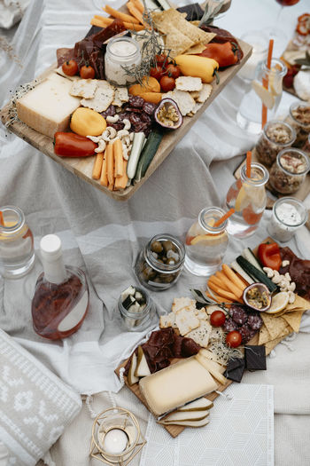 Abundance of food for a picnic on white blanket