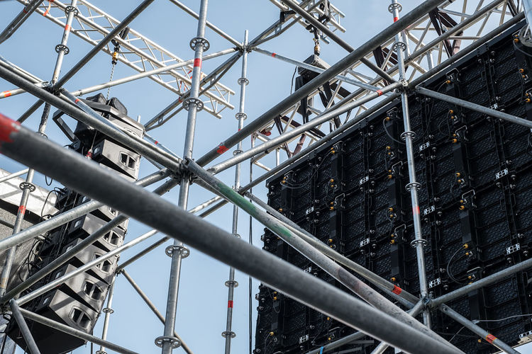 Behind of a led monitor display on scaffold scene and speakers