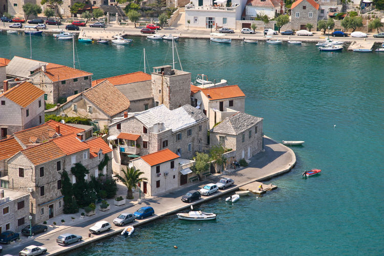 High angle view of boats moored at harbor