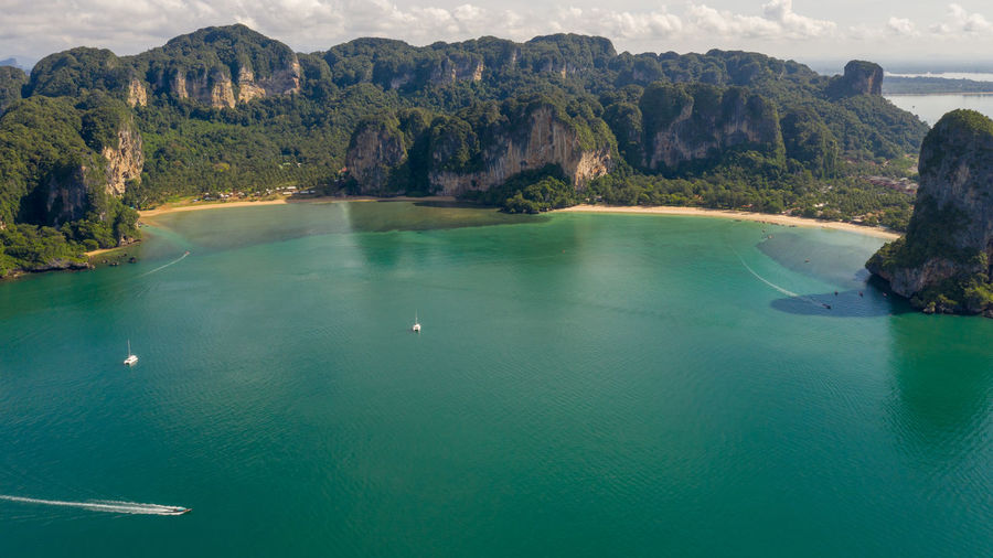 Amazing thailand high season beautiful seascape aerial view ao nang beach island and long tail boat 
