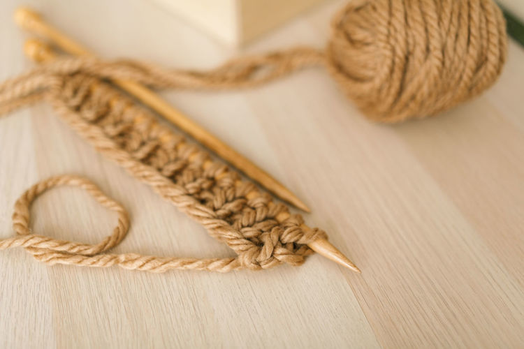 Close-up of rope tied on wooden table