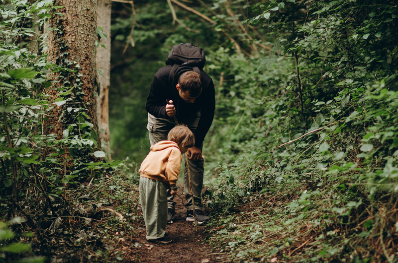 Little boy with dad  in the in forest