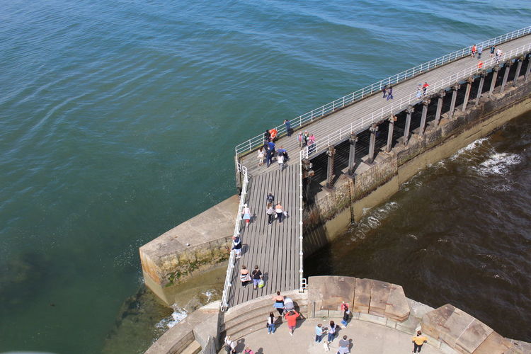 High angle view of people by sea