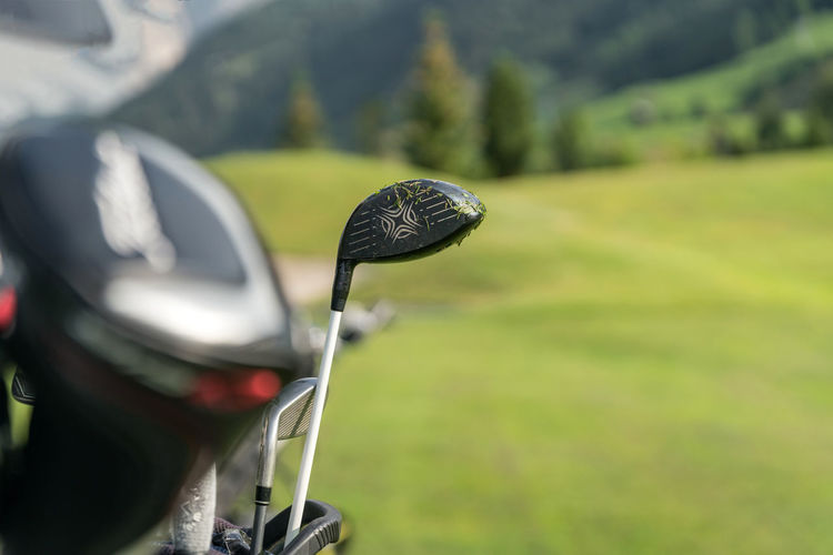Close-up of golf club on field