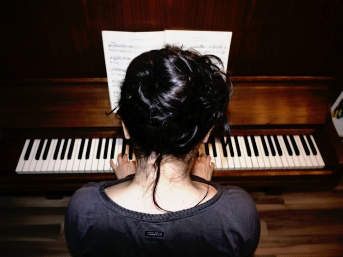 Woman playing with piano