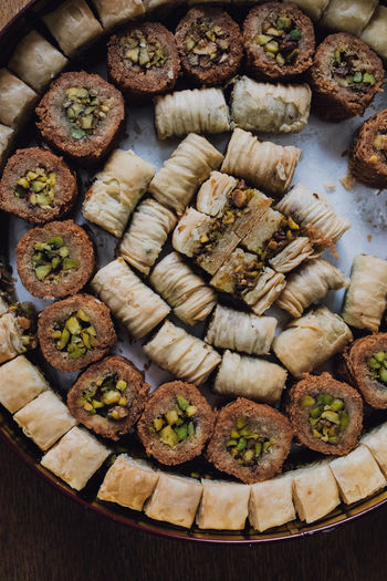 Circular tin of assorted baklava filo middle eastern pastry sweets