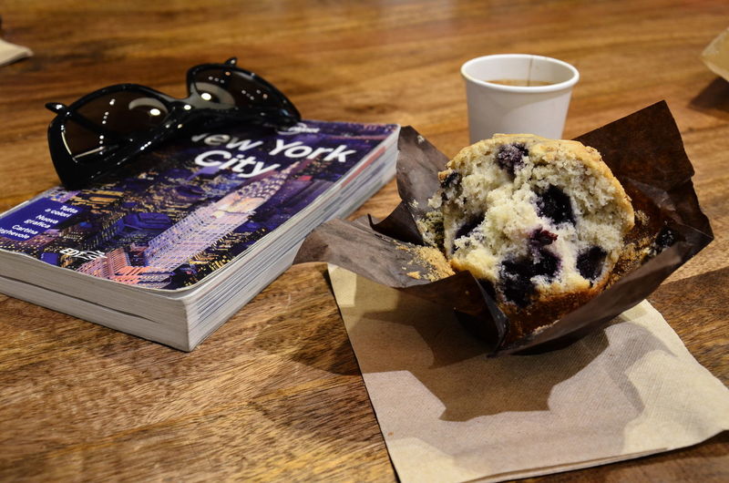 High angle view of dessert by book with text on table