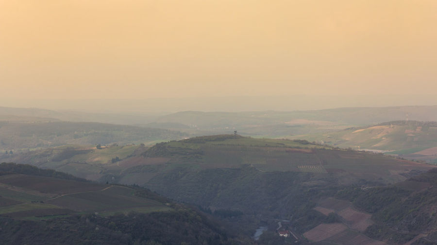 Scenic view of landscape against sky during sunset