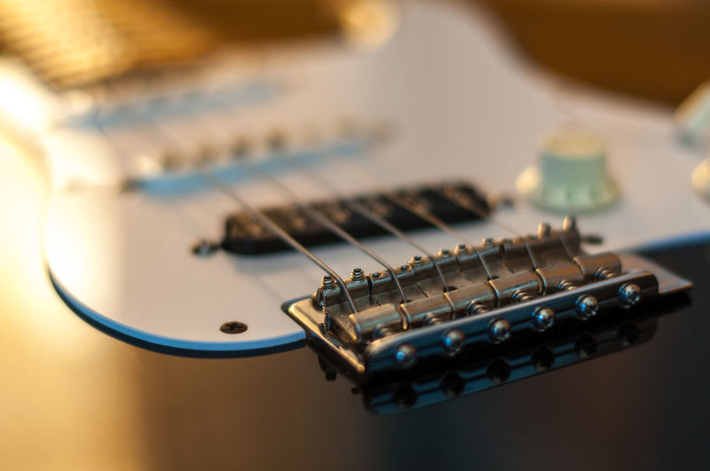 Close-up of guitar on table