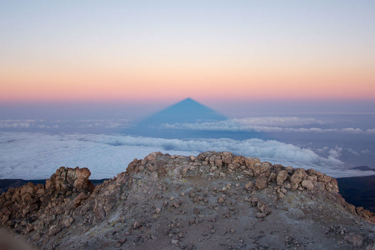 Scenic view of teide volcan's shadow on the ocean from the top of 3719 mt at the sunrise