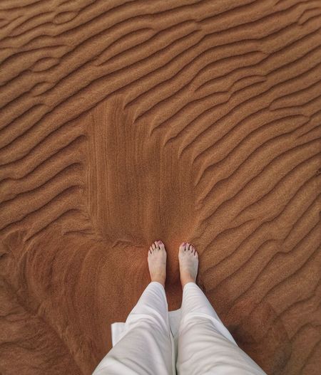 Feet in desert sand
