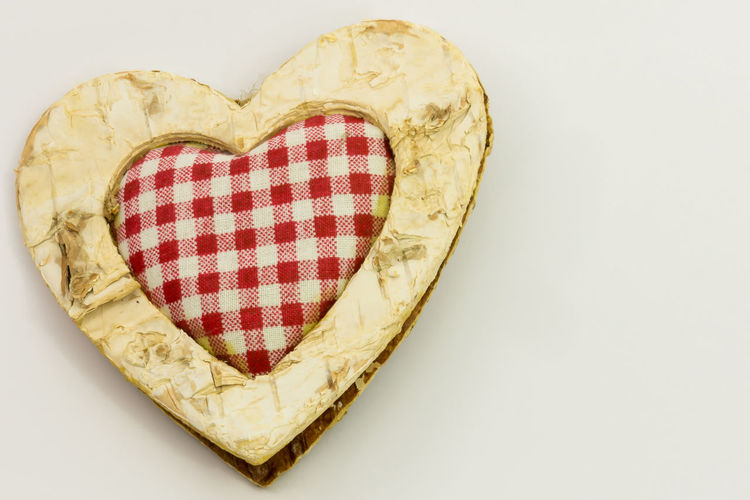 High angle view of heart shape against white background