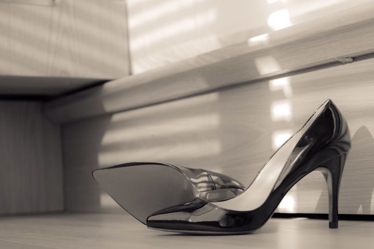 Close-up of high heels on floor