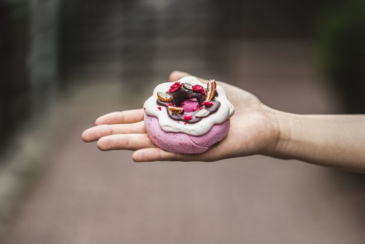 Cropped image of hand holding dessert