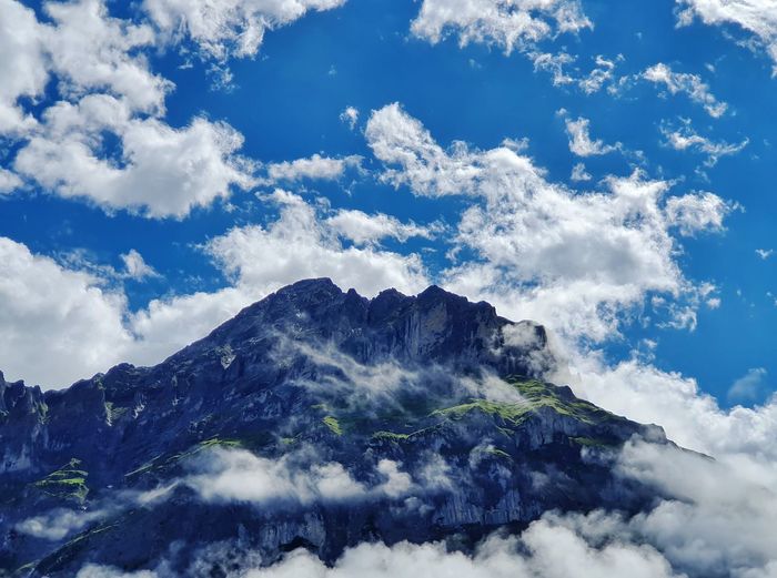 Low angle view of majestic mountains against sky