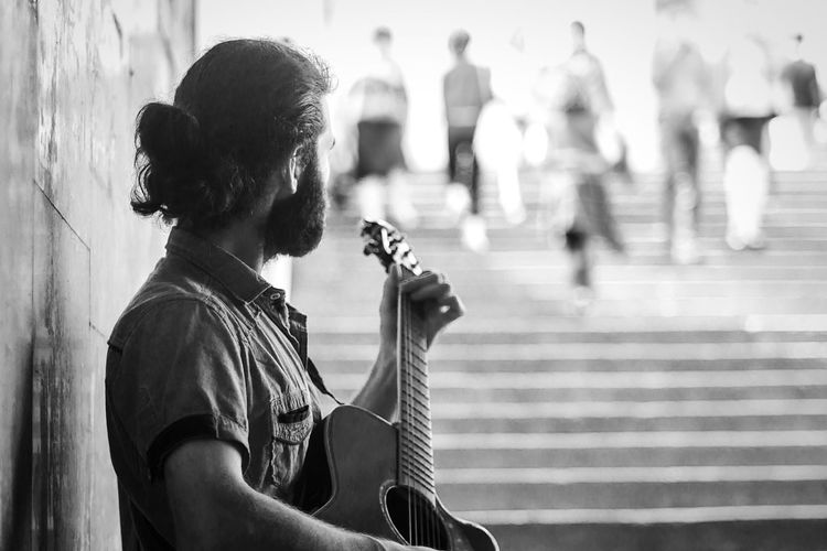 Street musician playing guitar