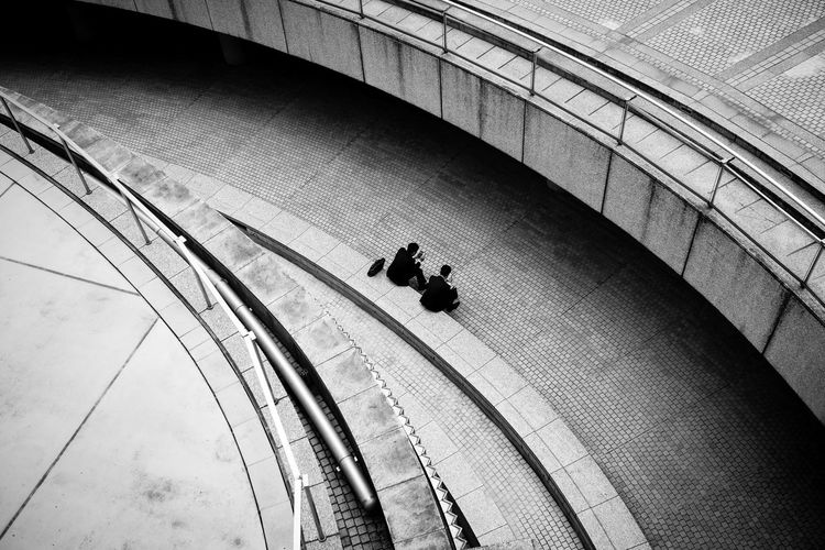 High angle view of people on escalator in city